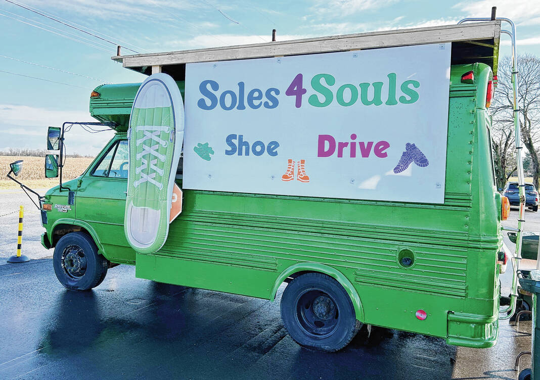 Giant shoe, bright green van draws eyes to Greenwood church