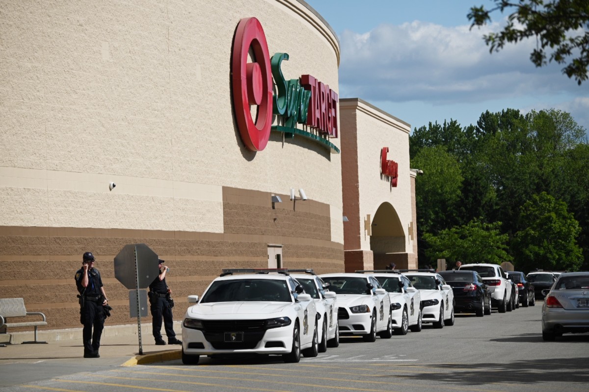 Police vehicles line the front of the Greenwood Super Target Saturday afternoon after a night of violent protests in nearby Indianapolis. Scott Roberson photo