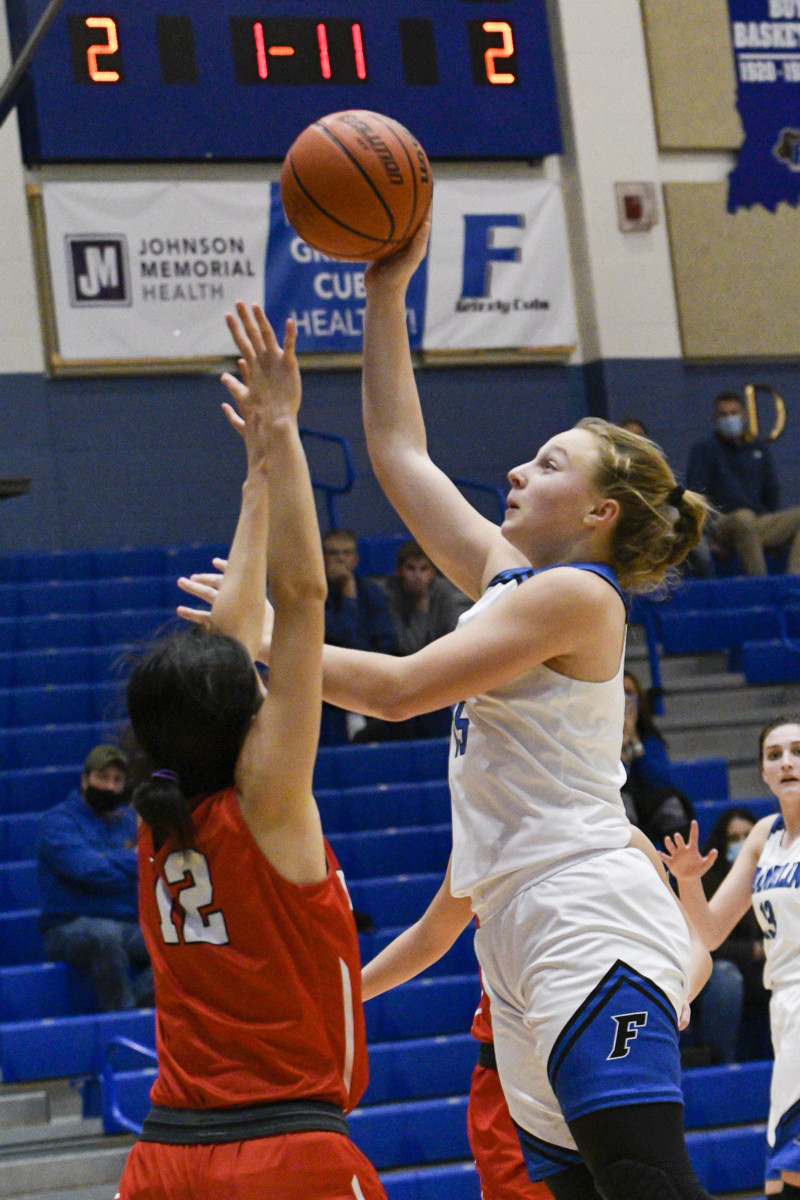 Franklin freshman Erica Buening shoots over Center Grove sophomore Kaho Takeda during Franklins 30-29 victory over Center Grove on Tuesday at Franklin Community High School.