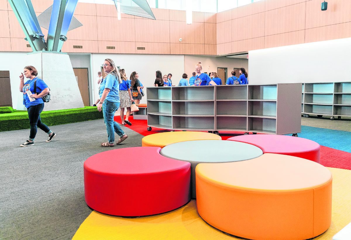 Clark-Pleasant staff and guests look at Ray Crowe Elementary School's open air media center on Thursday following a dedication ceremony.  Scott Roberson | Daily Journal
