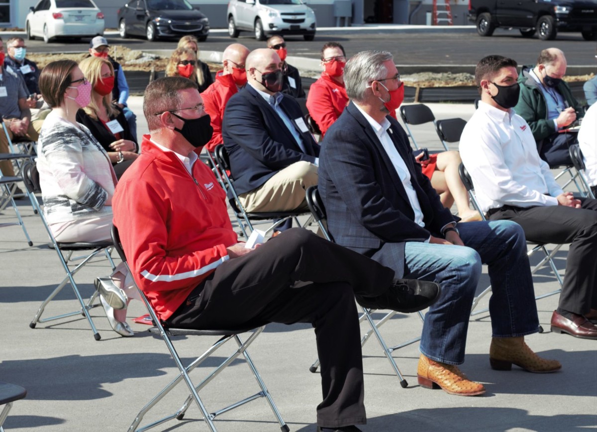 Greenwood Mayor Mark Myers and Gov. Eric Holcomb sit in the crowd Thursday at the grand opening of the Milwaukee Tool service hub in Greenwood. Photos by Emily Ketterer | Daily Journal