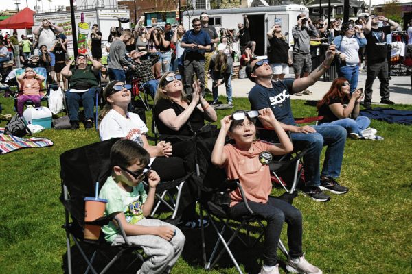 Hundreds watch, celebrate as once-in-a-lifetime eclipse darkens Johnson County
